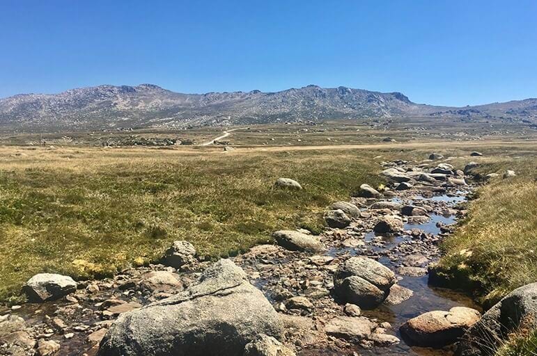 Landscape view of creek and bottom of mountains