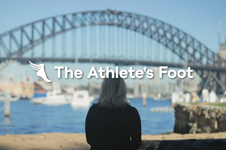 Back of model facing Sydney Harbour, says The Athlete's Foot
